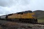 UP SD59MX #9907 leads the Cache Valley Local (LCG-41E) approaching the 4800 W. 900N. grade xing in Trenton, Utah. April 15, 2022